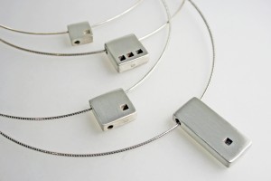 Pendants, sterling silver on cables, Architecture Series. Photo courtesy Kari Woo.